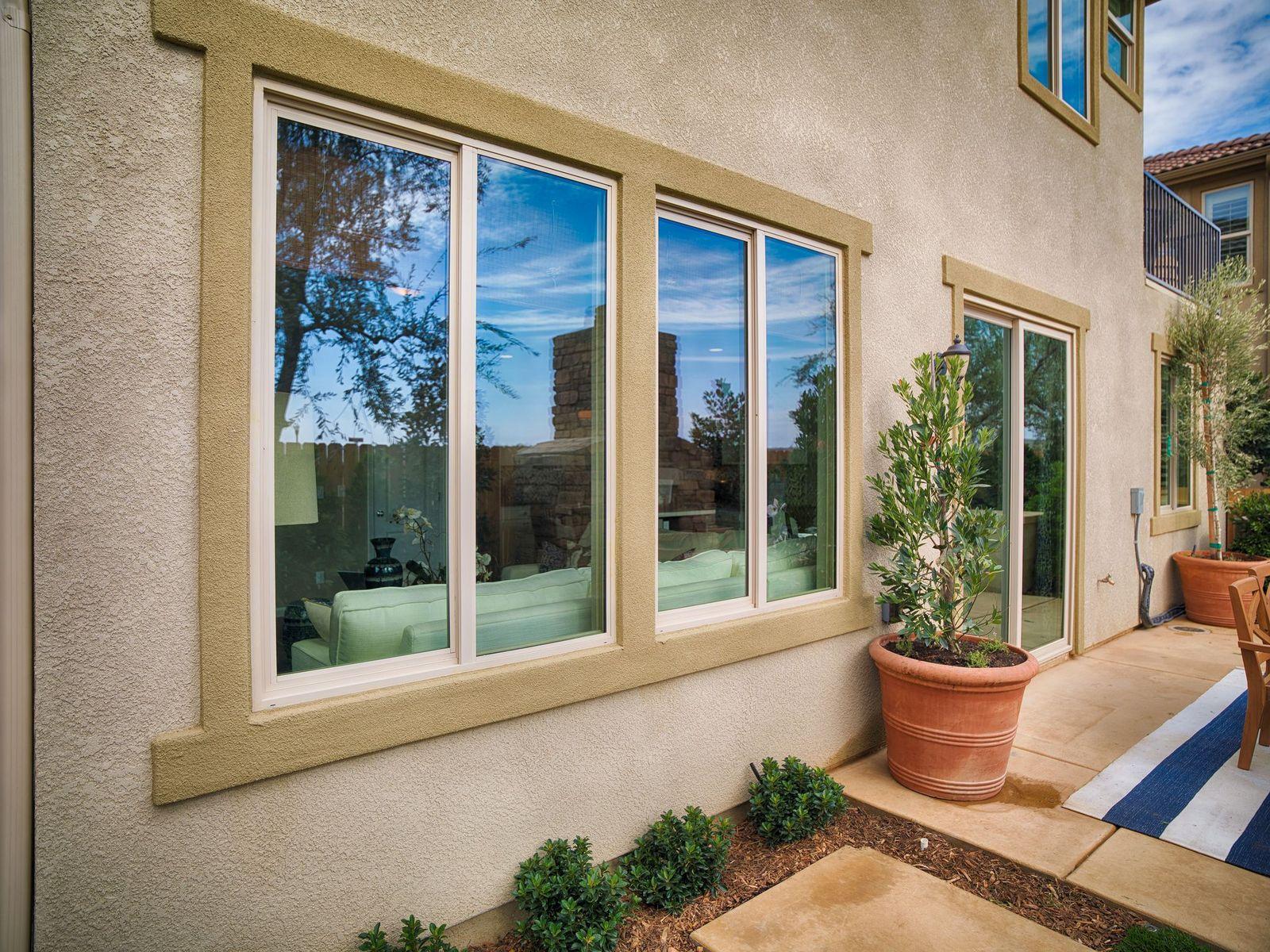 monte verde bay view windows from outside stucco home