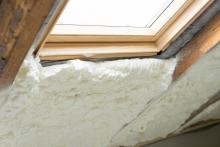 spray foam insulation in attic with window