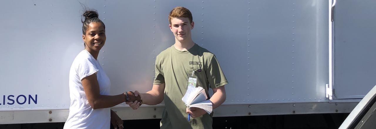 Greencat Employee Shaking Hands with Happy Customer