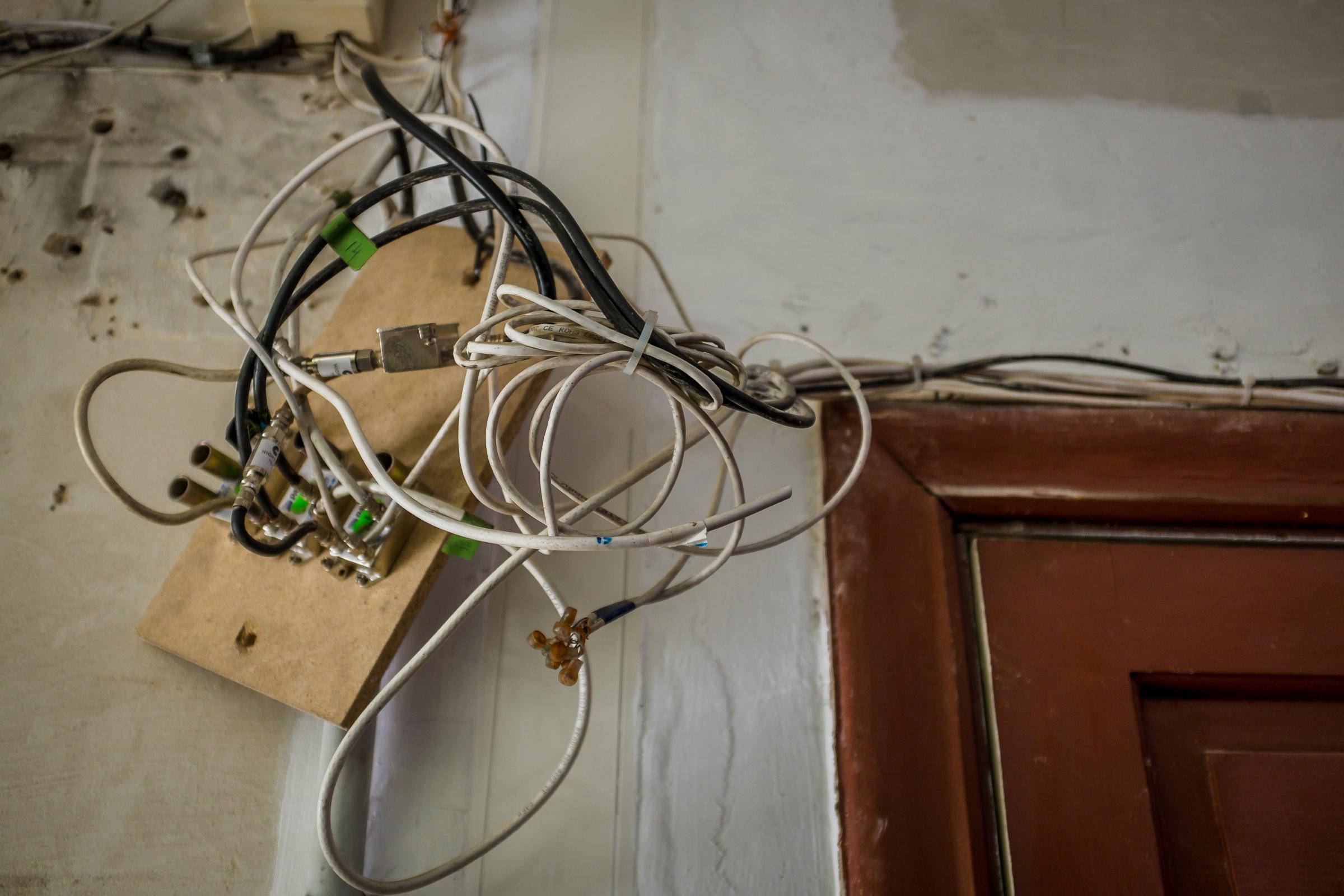 electrical wires hanging from ceiling in old house