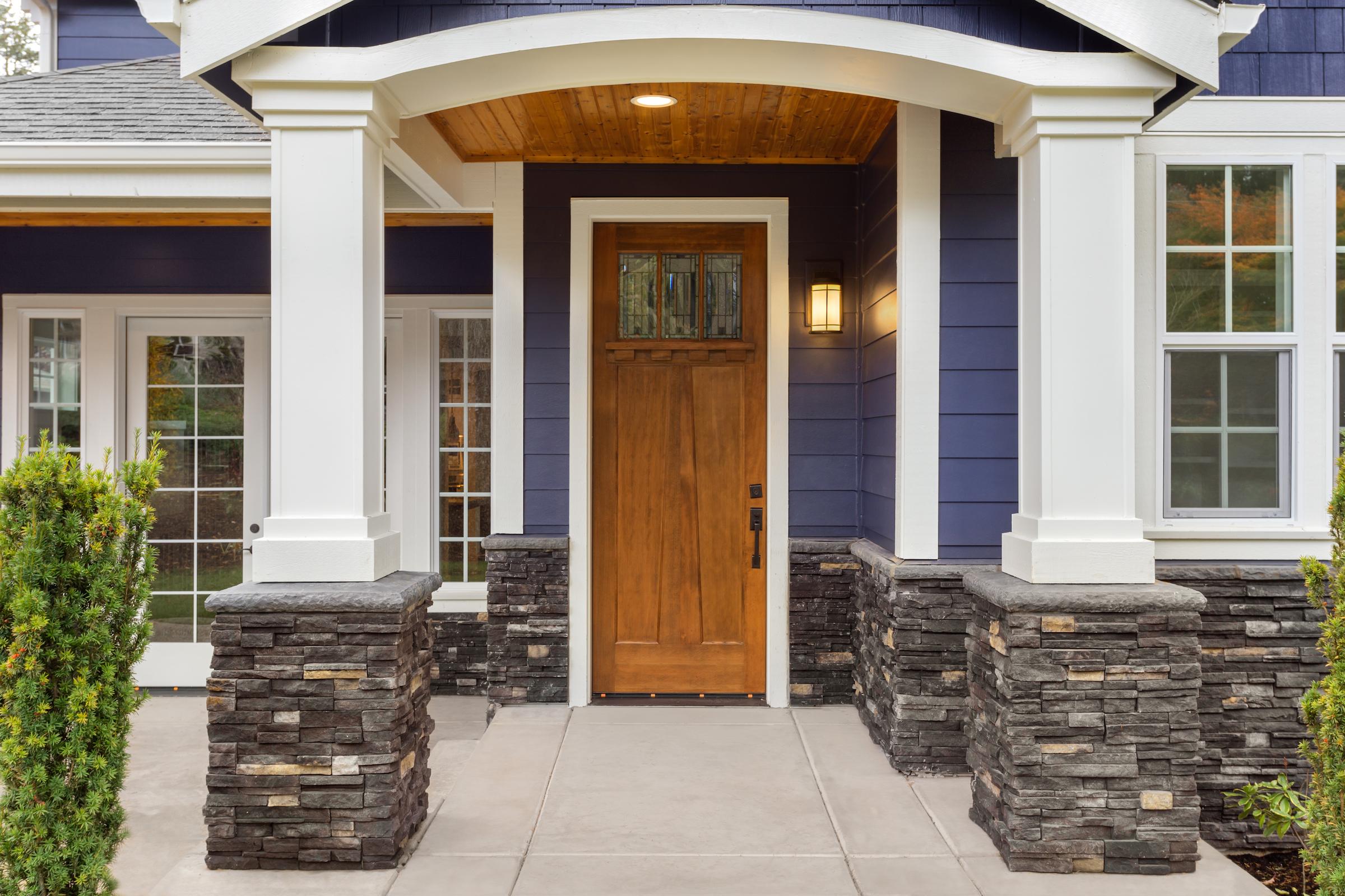 Exterior view of the front door and windows of a home