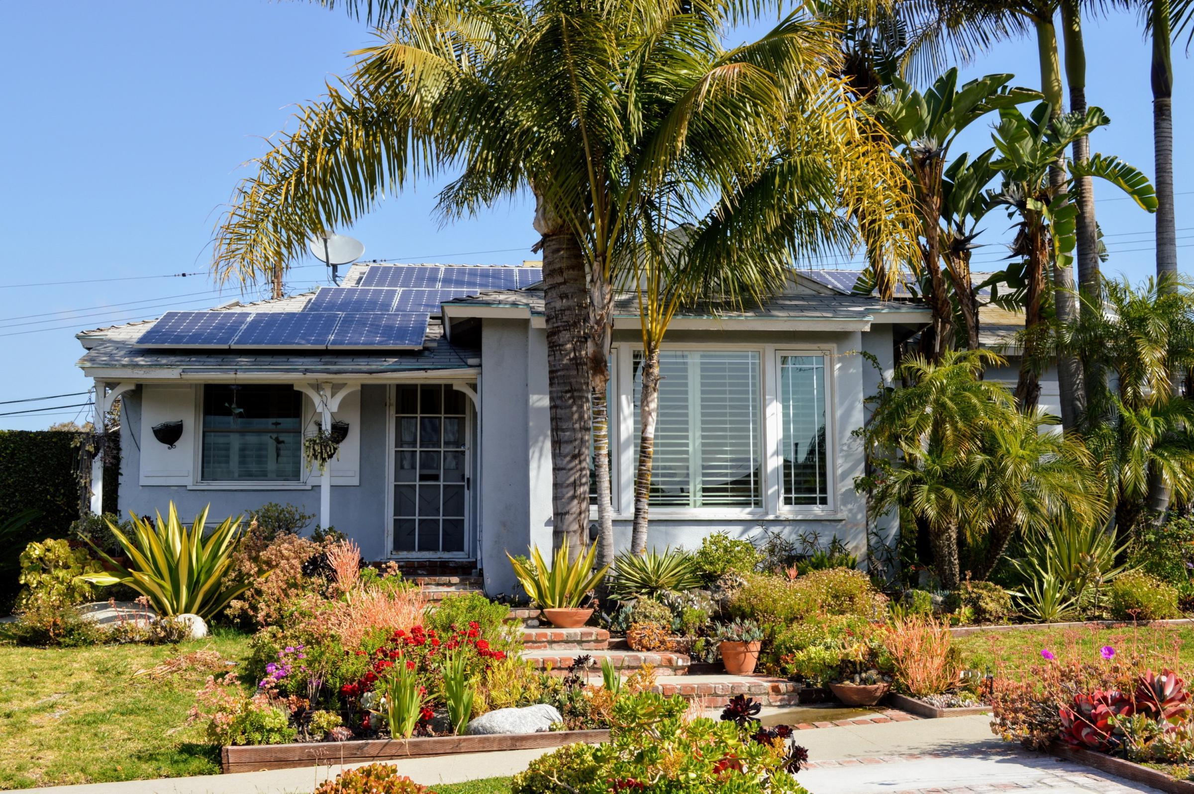 modern California home with solar panels on roof