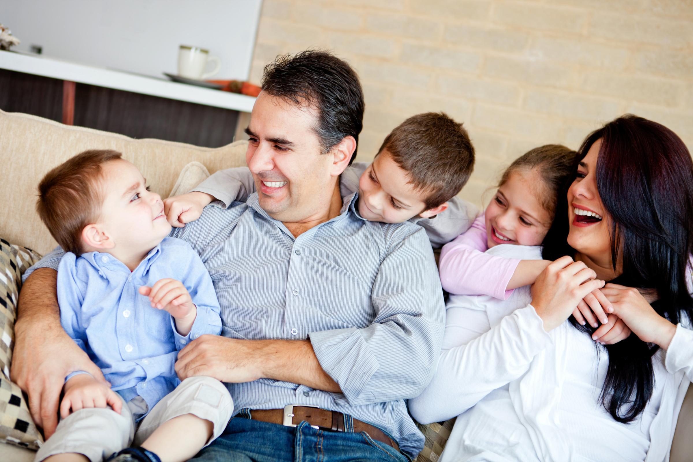 Happy Family in Living Room Couch Happy Family in Living Room Couch